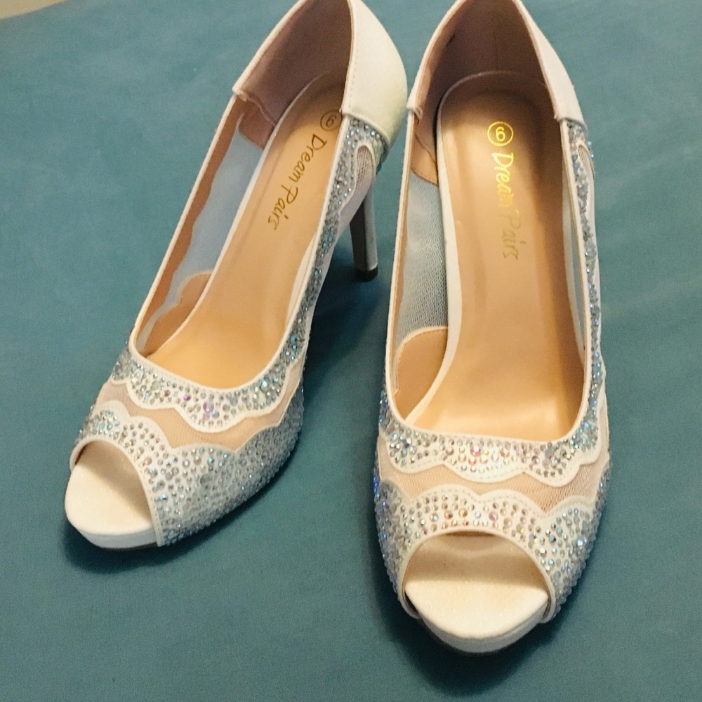 Sparkly white high heel shoes